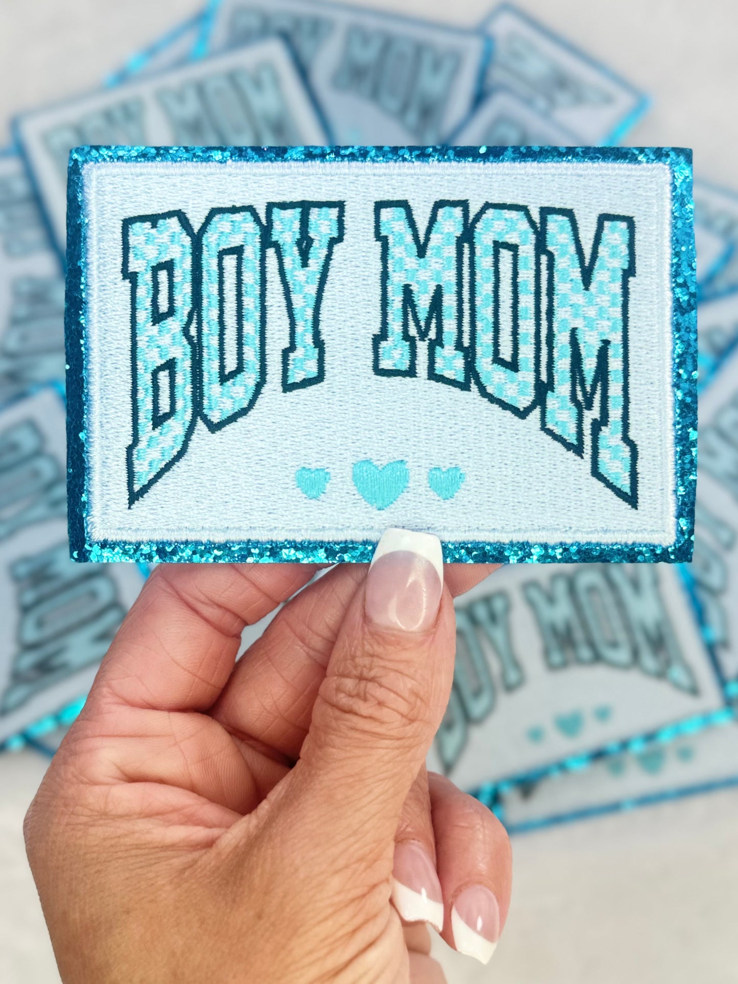 A close up pic of the Boy Mom Embroidered Patch