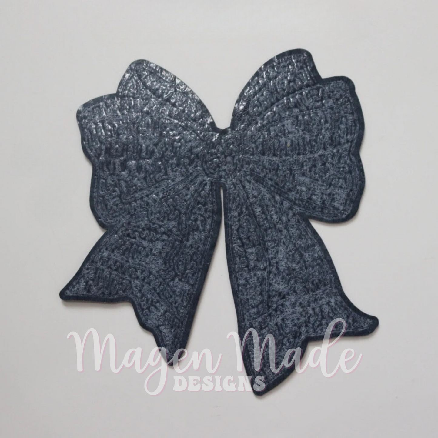 Iron on backing on the Coquette Football Bow Iron On Sequin Patch