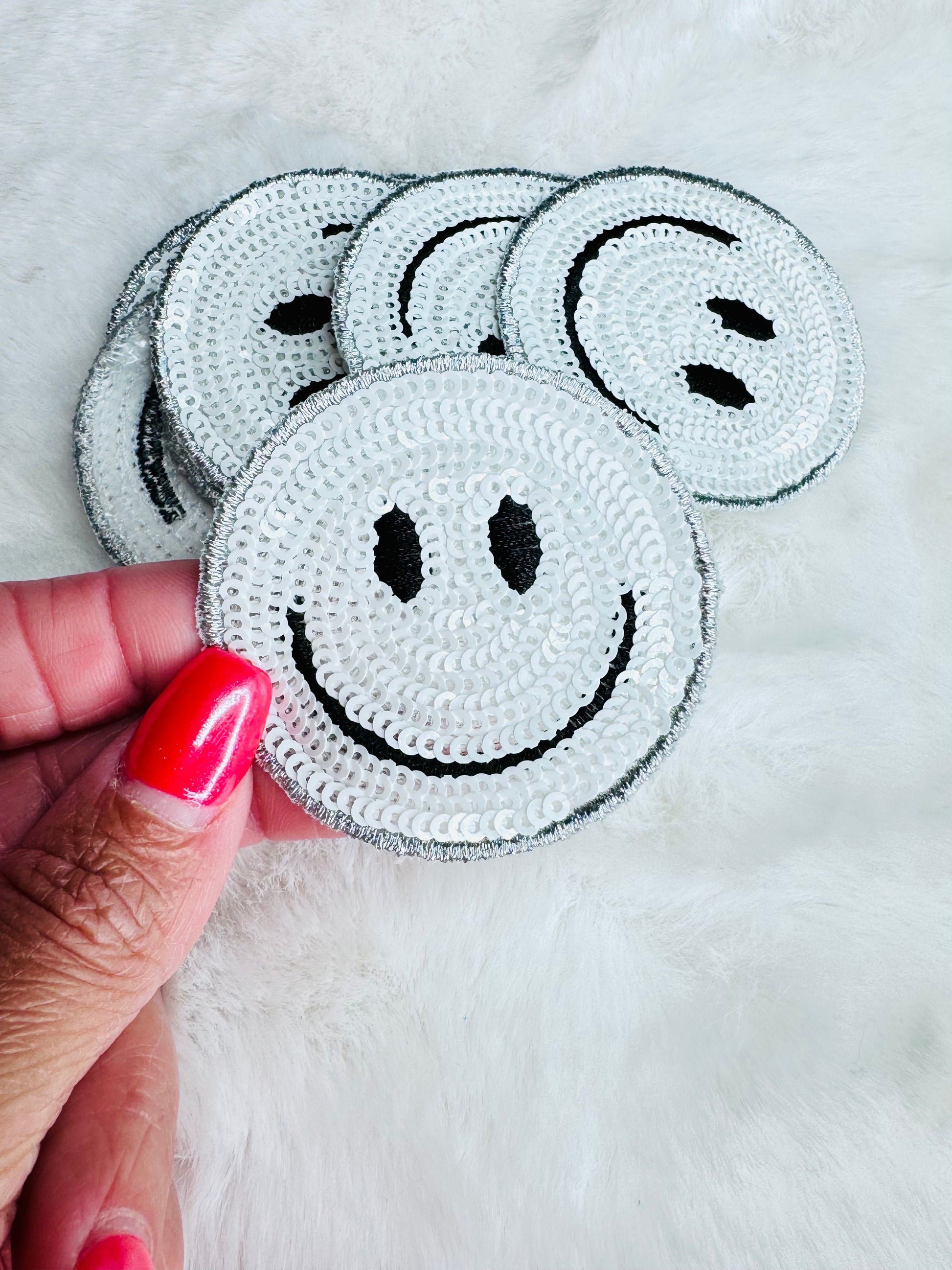 White sequin smiley face patch