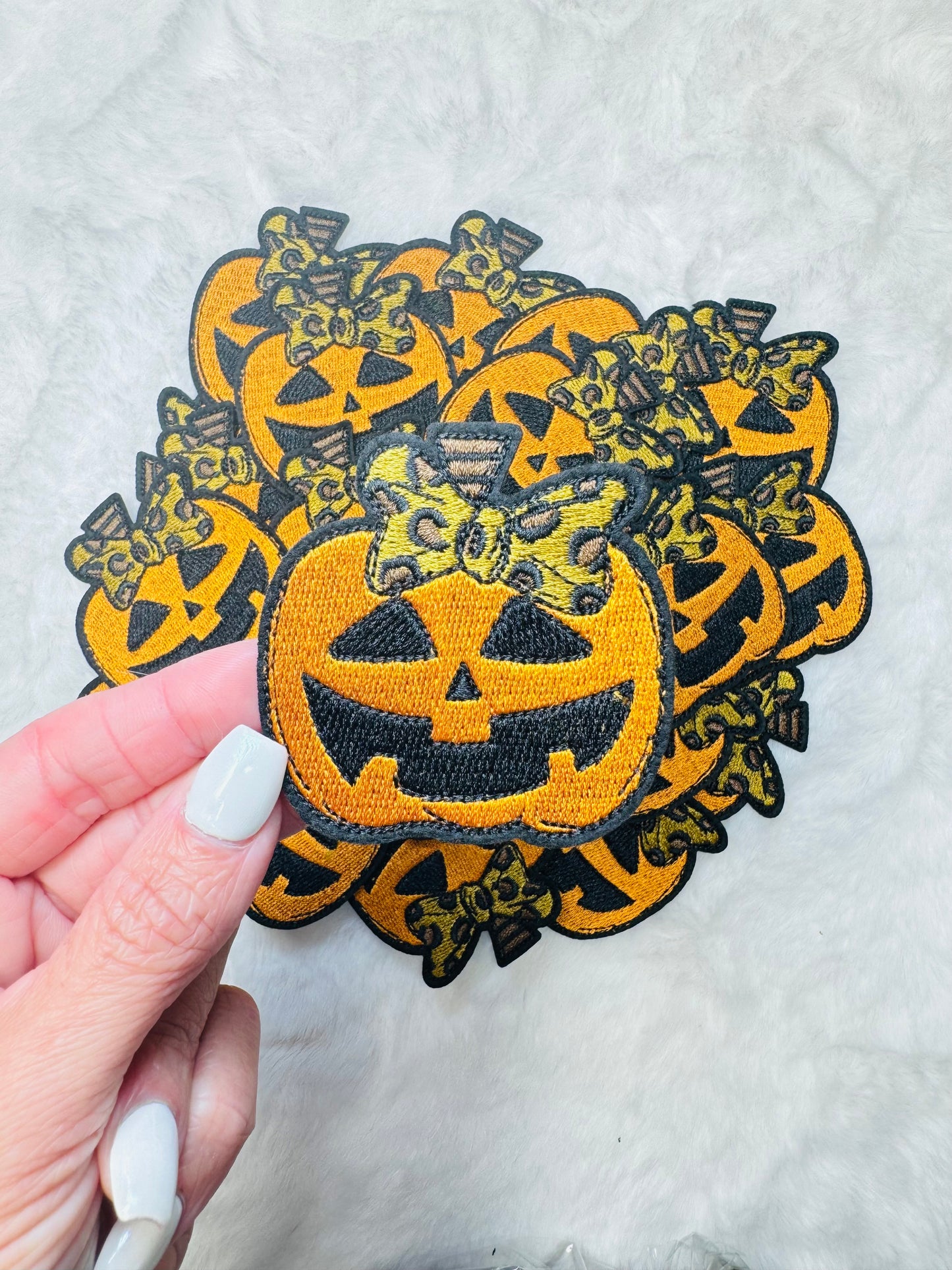 Carved Pumpkin With A Leopard Coquette Bow Embroidered Patch