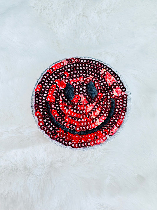 Red sequin smiley face