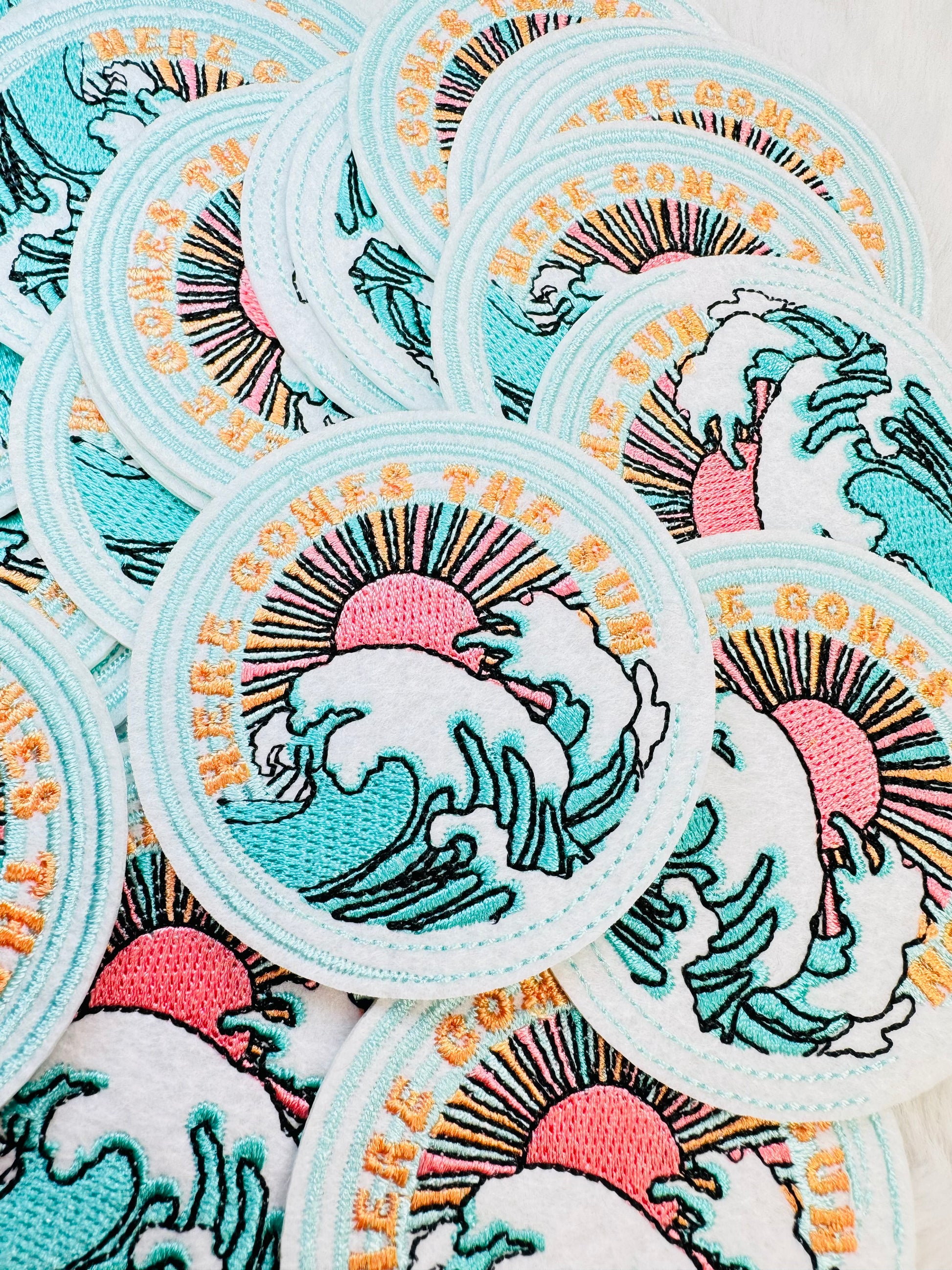 Up close stack of Here Comes The Sun Embroidered Patch