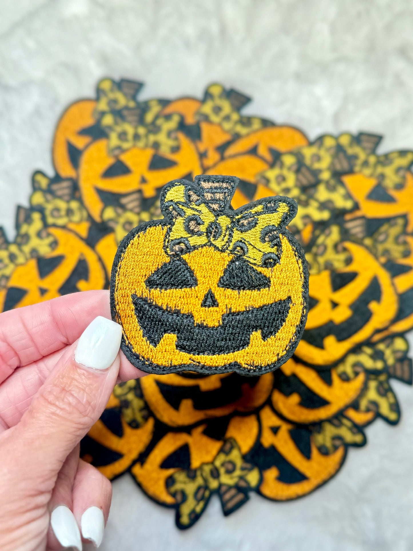 Carved Pumpkin With A Leopard Coquette Bow Embroidered Patch