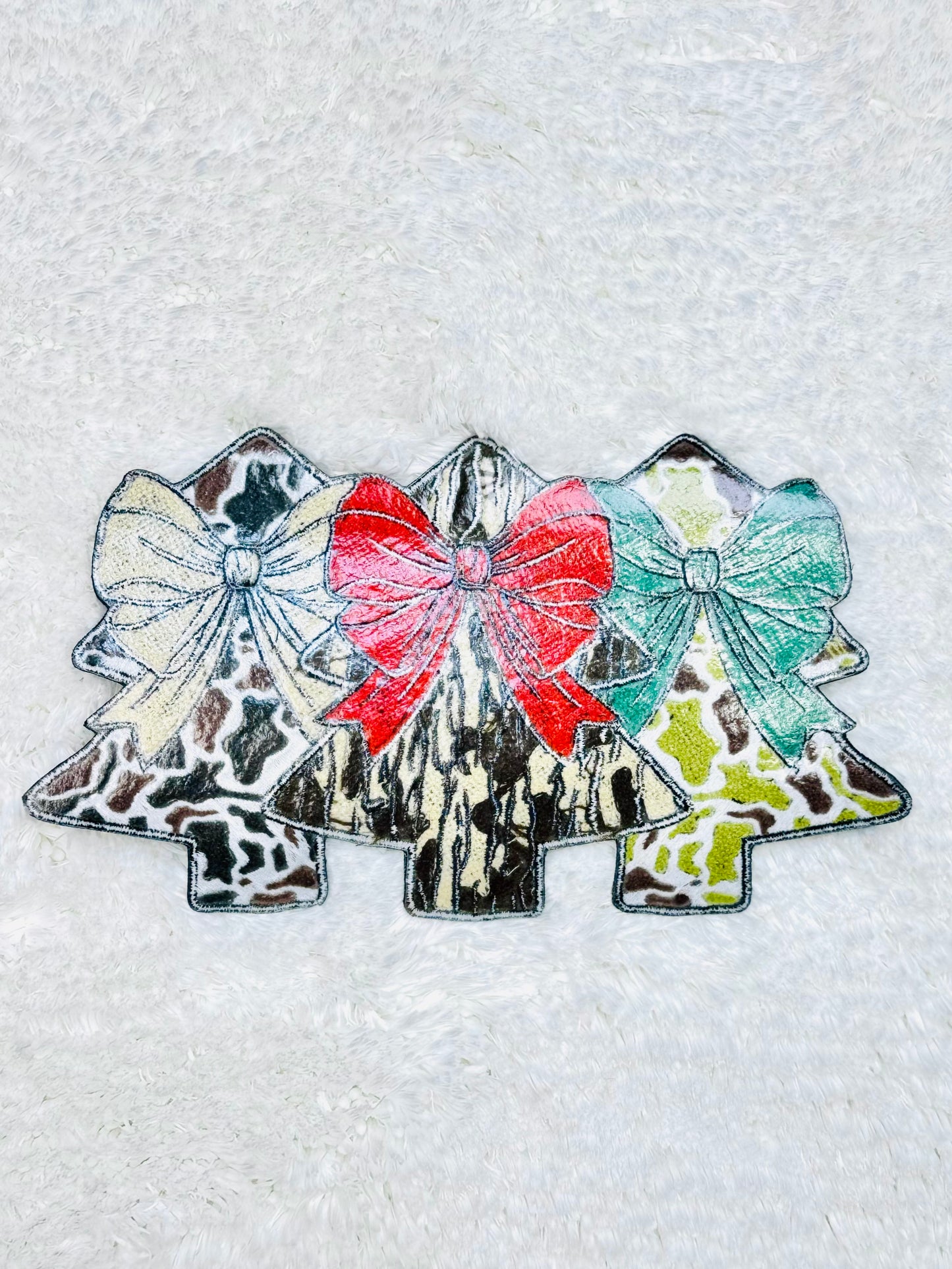 The back side of the Camo Coquette Christmas Tree Trio Chenille Patch