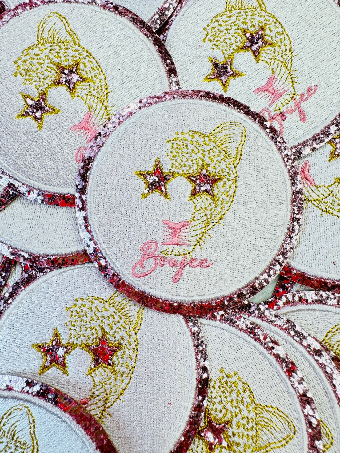 A stack of the Boujee Leopard Embroidered Patch