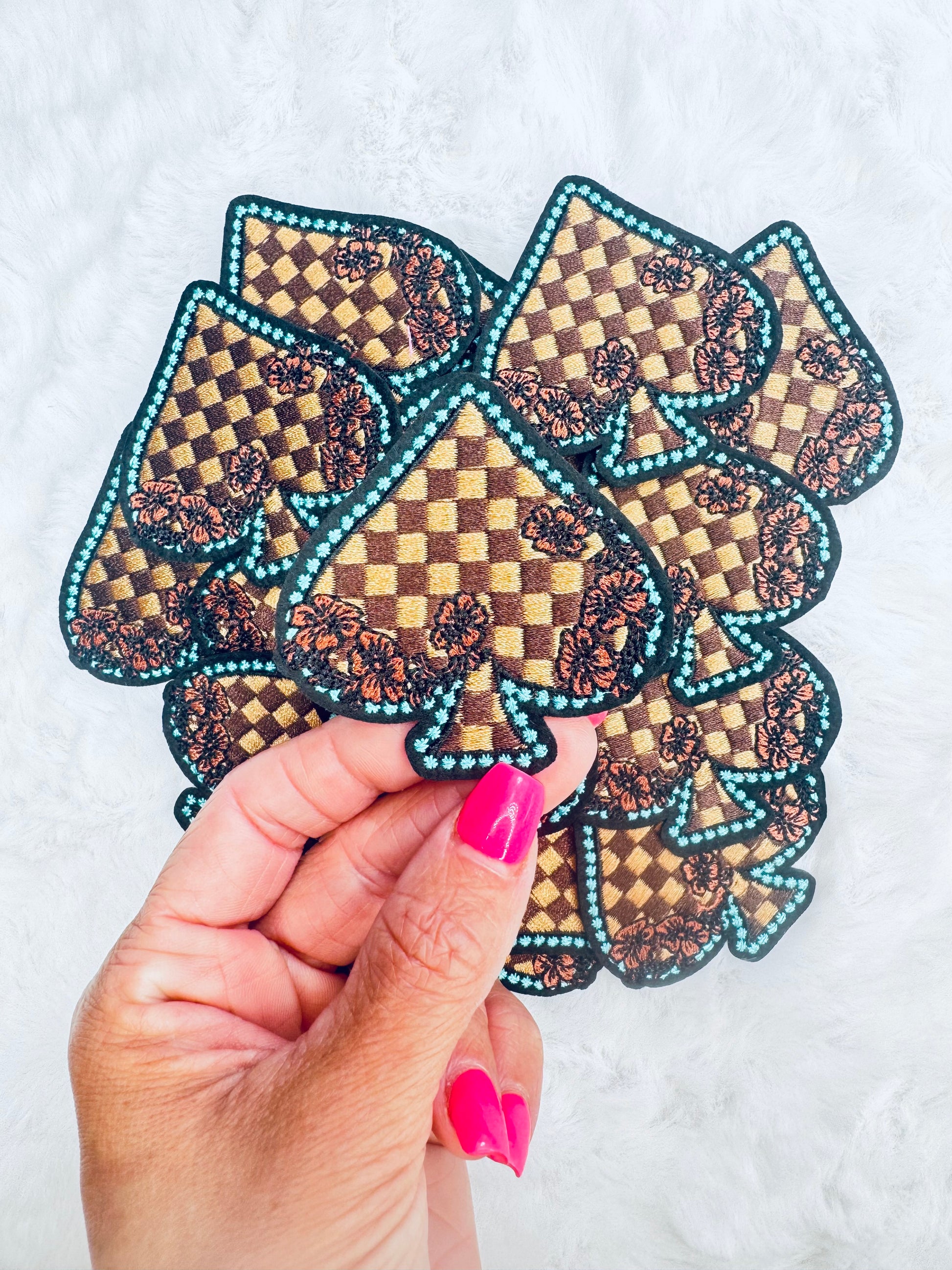 Far away of the Checkered Floral Spade Embroidered Patch