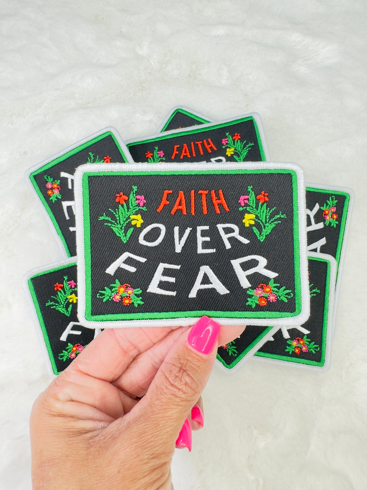 Close-up of the faith over fear embroidered patch