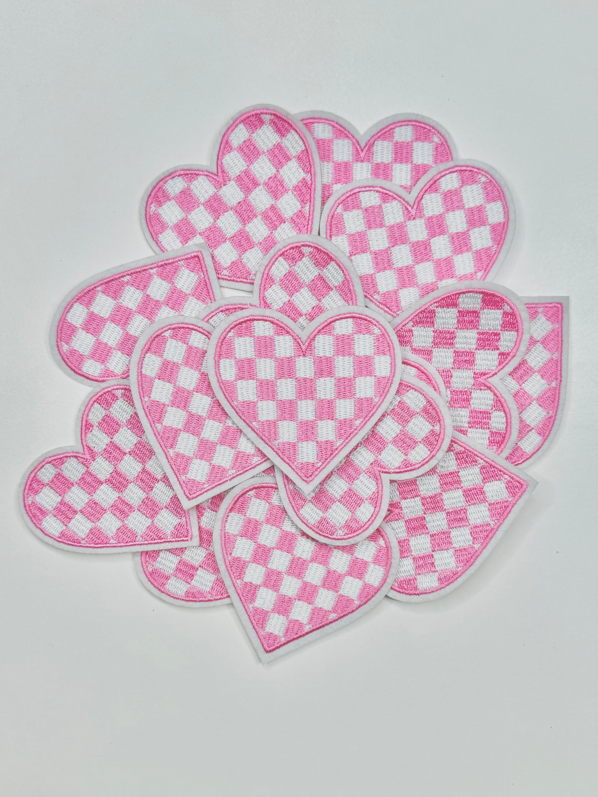 A stack of the Lovely Light Pink and White Checkered Heart